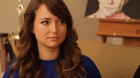 Milana Vayntrub having fun with a microphone. GIF made by。